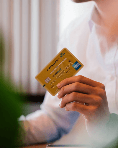 person holding amex card