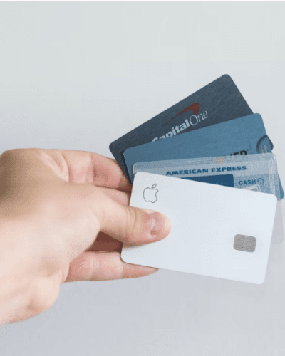 hand holding 4 credit cards