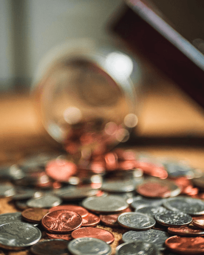 person holding a jar labelled savings