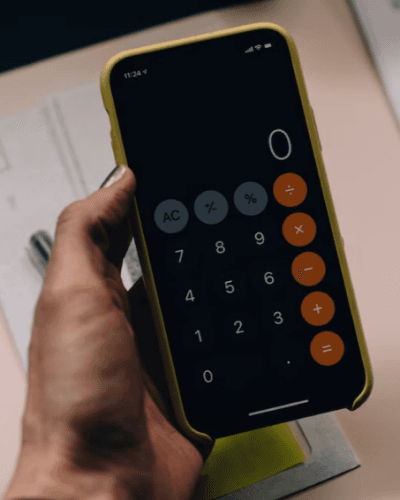 Person holding a calculator